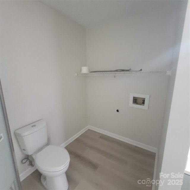 bathroom with wood-type flooring and toilet