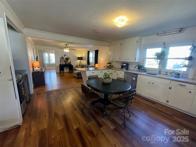 dining space featuring ceiling fan and dark wood-style flooring