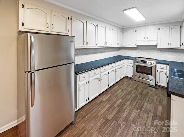 kitchen with white cabinetry, appliances with stainless steel finishes, dark hardwood / wood-style floors, and decorative backsplash