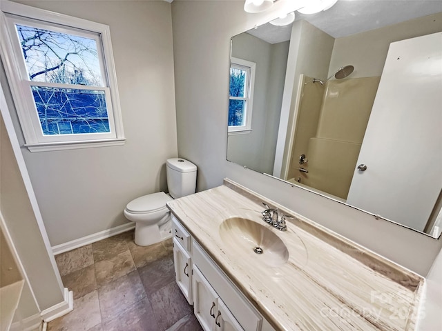 full bathroom featuring bathing tub / shower combination, vanity, and toilet