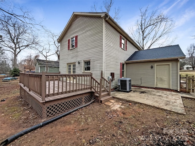 back of house featuring cooling unit, a deck, and a patio