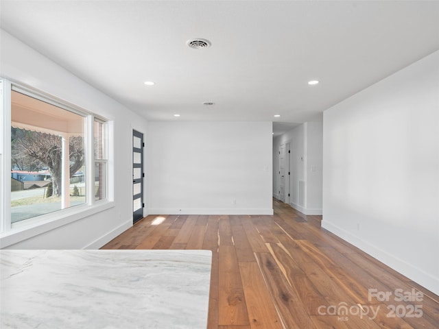 empty room featuring hardwood / wood-style flooring