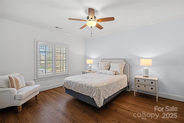 bedroom with ceiling fan, ornamental molding, and dark hardwood / wood-style flooring