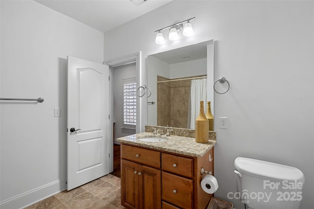 bathroom with vanity, toilet, and a shower with shower curtain