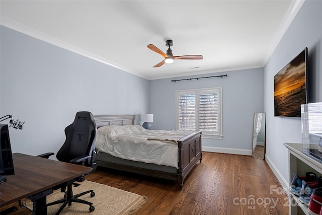 bedroom with dark wood-type flooring, ceiling fan, and ornamental molding