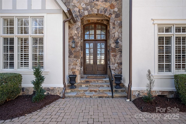 property entrance featuring french doors