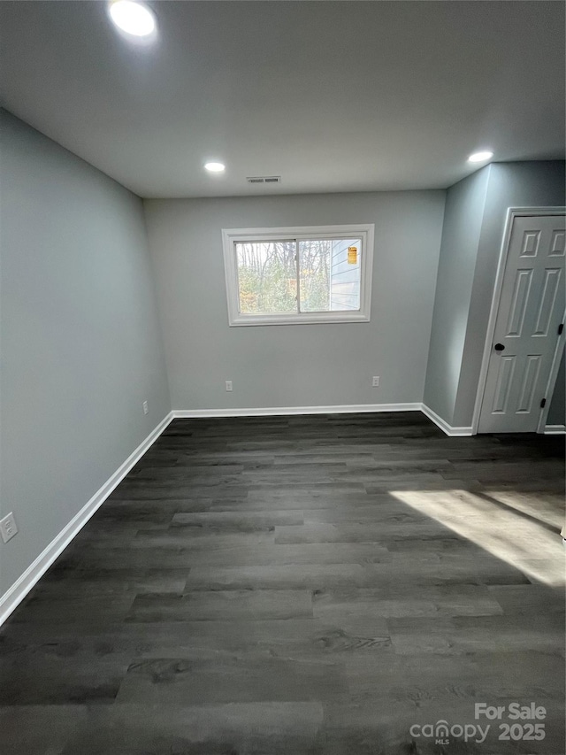 basement with dark wood-type flooring