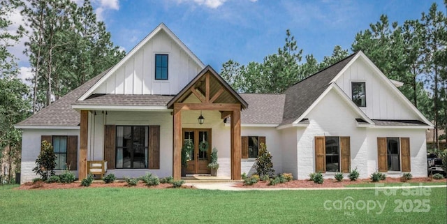 modern inspired farmhouse featuring french doors and a front lawn