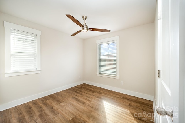 spare room with ceiling fan and hardwood / wood-style floors