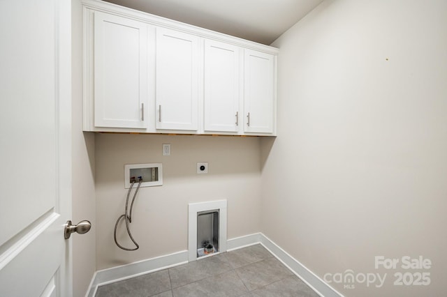 laundry room featuring washer hookup, electric dryer hookup, light tile patterned floors, and cabinets