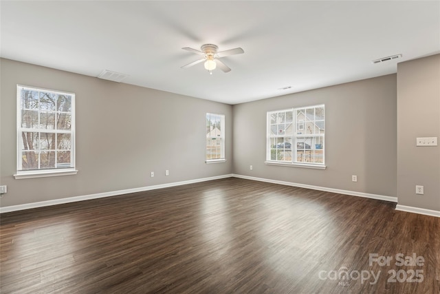 unfurnished room featuring ceiling fan and dark hardwood / wood-style flooring