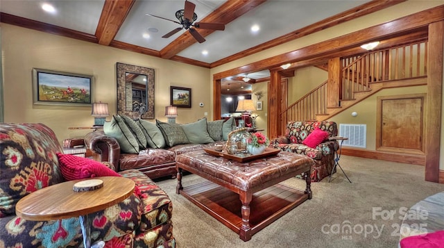 living room with visible vents, ceiling fan, stairs, carpet flooring, and beam ceiling