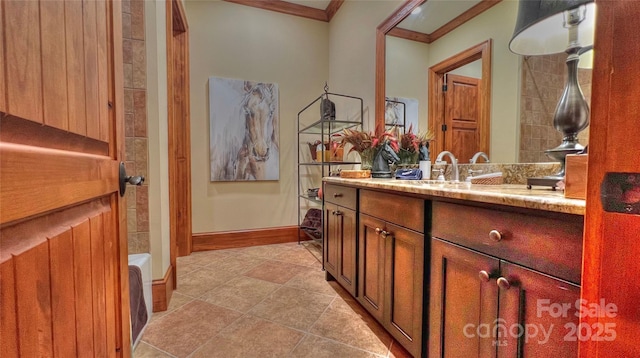 full bathroom featuring ornamental molding, vanity, baseboards, and tile patterned floors