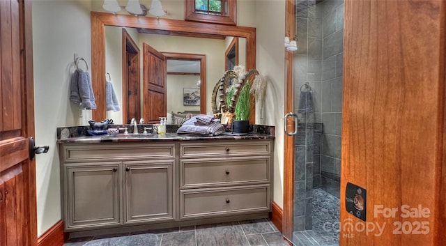 full bath featuring a stall shower and vanity