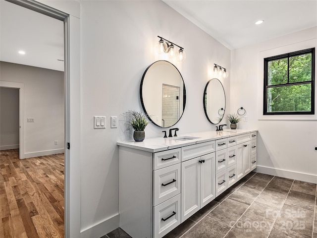 bathroom with vanity and wood-type flooring