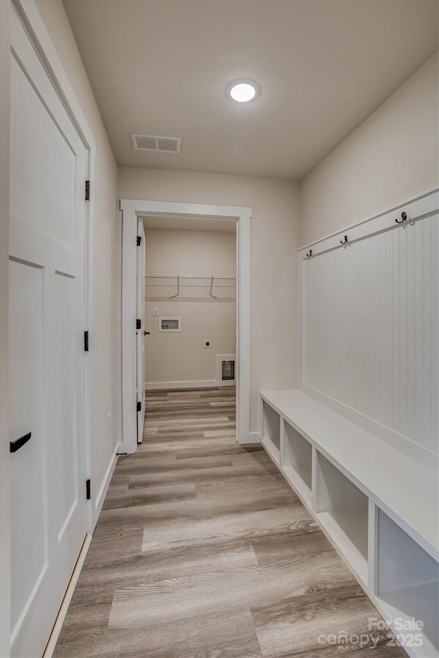 mudroom with light wood-type flooring