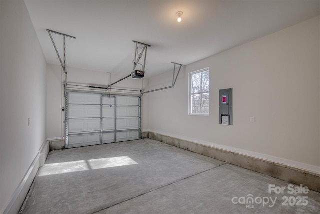 garage with a garage door opener and electric panel