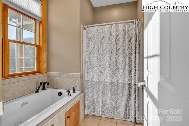 bathroom featuring tile patterned floors and separate shower and tub