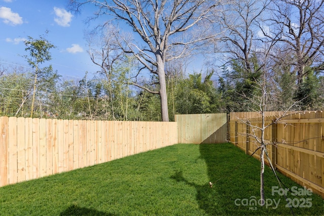 view of yard with a fenced backyard