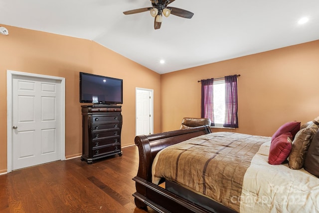 bedroom with ceiling fan, dark hardwood / wood-style flooring, and vaulted ceiling