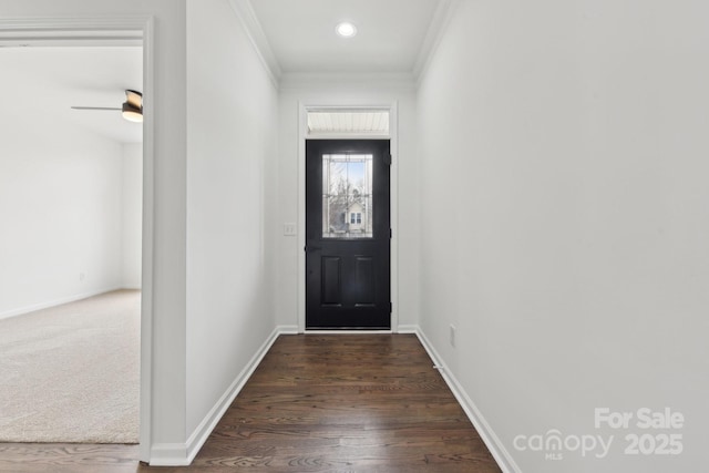 doorway to outside featuring ornamental molding and dark hardwood / wood-style flooring