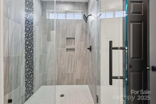 bathroom featuring an enclosed shower