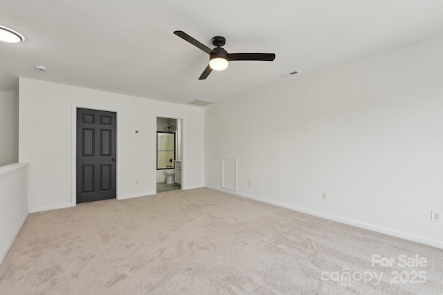 unfurnished room featuring light carpet and ceiling fan