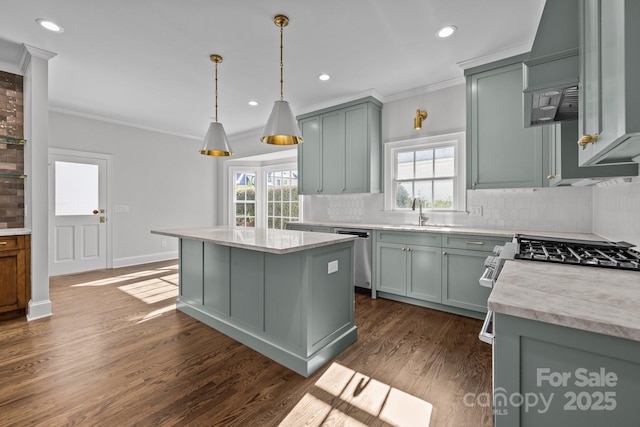 kitchen with sink, dishwasher, ornamental molding, a kitchen island, and decorative backsplash