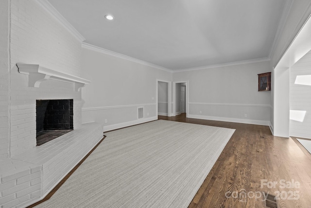 unfurnished living room featuring a brick fireplace, wood-type flooring, and ornamental molding