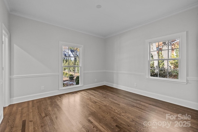 unfurnished room with hardwood / wood-style flooring and ornamental molding