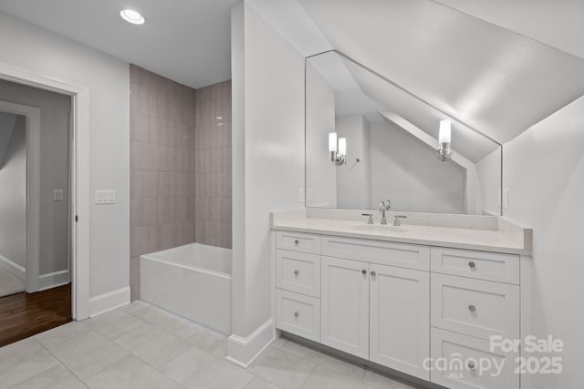 bathroom featuring  shower combination, tile patterned flooring, and vanity