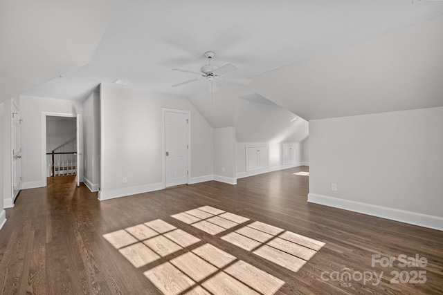 additional living space featuring vaulted ceiling, ceiling fan, and dark hardwood / wood-style flooring