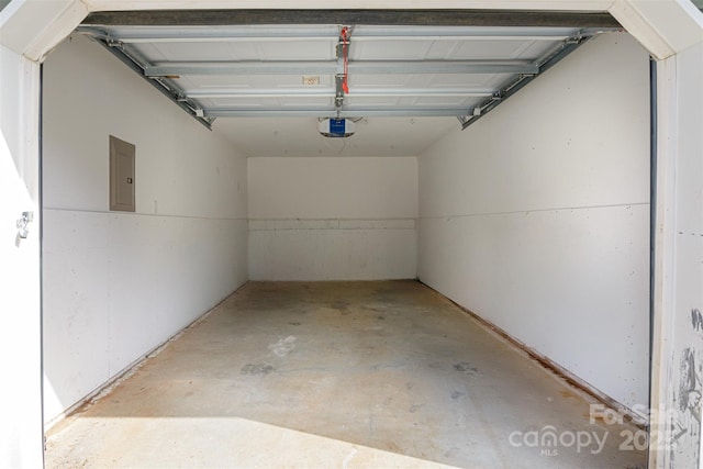 garage featuring a garage door opener and electric panel