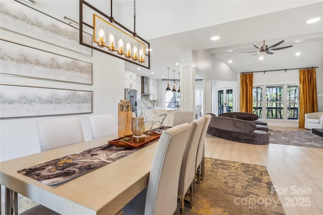 dining area featuring ceiling fan and wood-type flooring