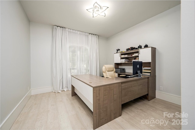 home office featuring light hardwood / wood-style flooring