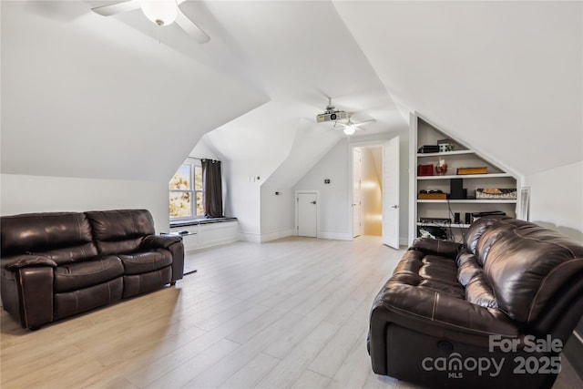 living room with ceiling fan, lofted ceiling, built in features, and light hardwood / wood-style flooring