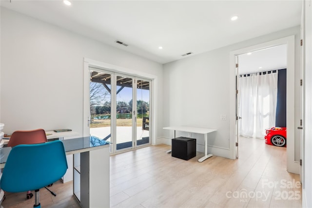 home office featuring light hardwood / wood-style floors