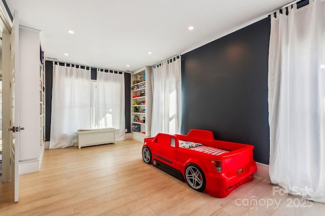 bedroom with light wood-type flooring