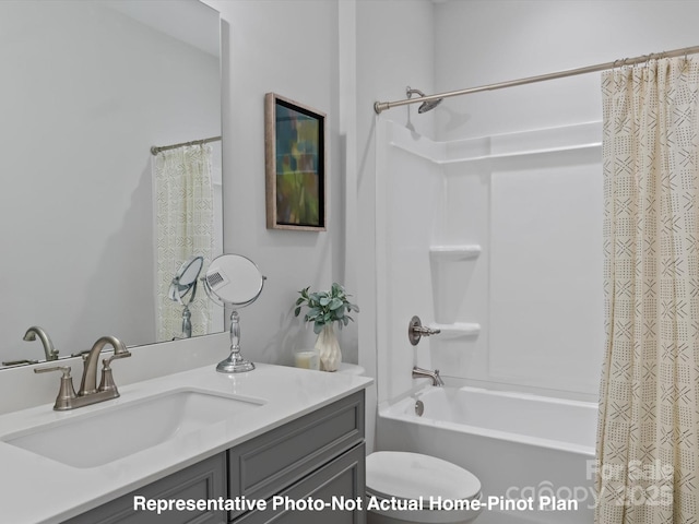 full bathroom with vanity, shower / bath combination with curtain, and toilet