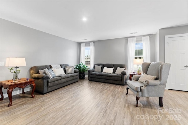 living room with light hardwood / wood-style floors