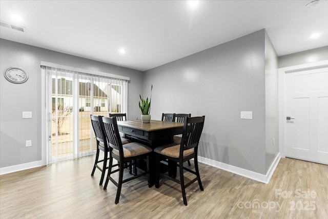 dining room featuring light wood-type flooring