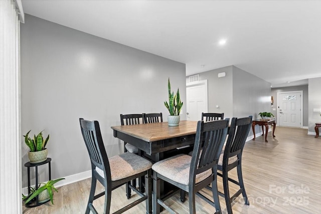 dining room featuring light hardwood / wood-style floors