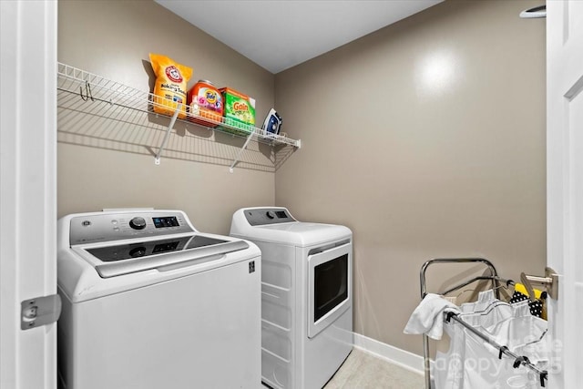 washroom featuring independent washer and dryer