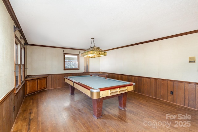 rec room featuring ornamental molding, billiards, and dark hardwood / wood-style floors