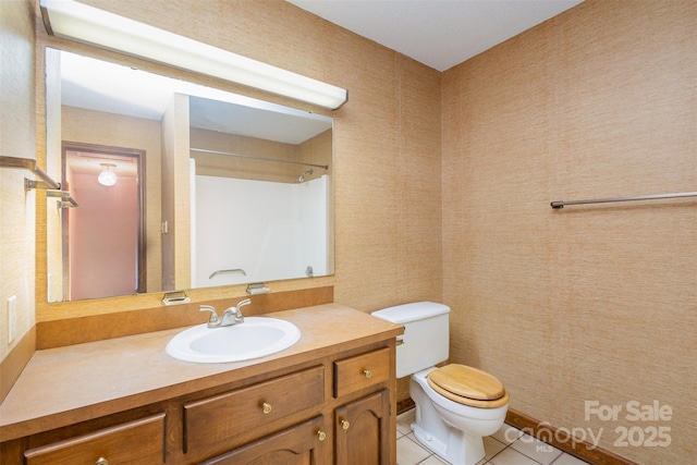 bathroom featuring walk in shower, tile patterned floors, toilet, and vanity