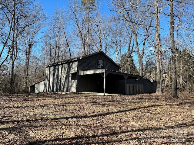 view of side of home with an outbuilding