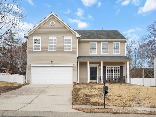 front of property featuring a garage and covered porch