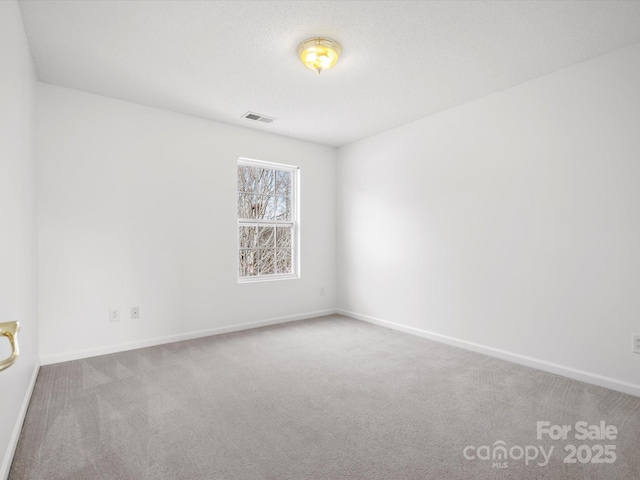 empty room with carpet flooring