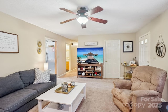 living room with ceiling fan and light carpet