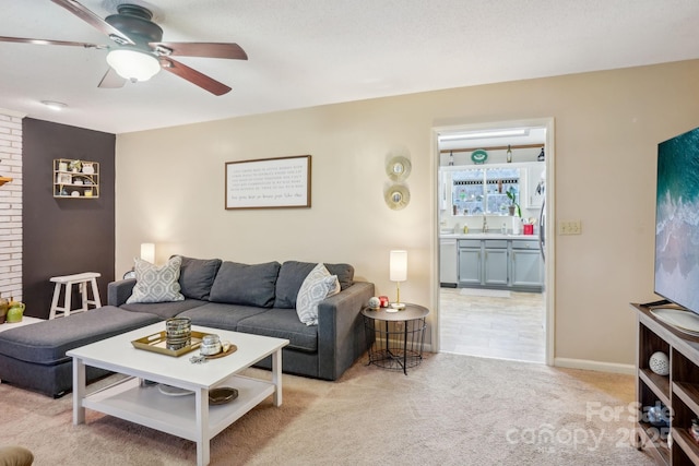 living room with light carpet and ceiling fan